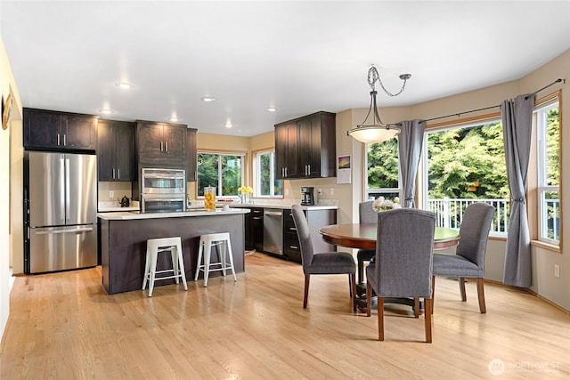 13218 42nd Ave W, Mukilteo, WA 98275 - dining room featuring light wood-style flooring and recessed lighting