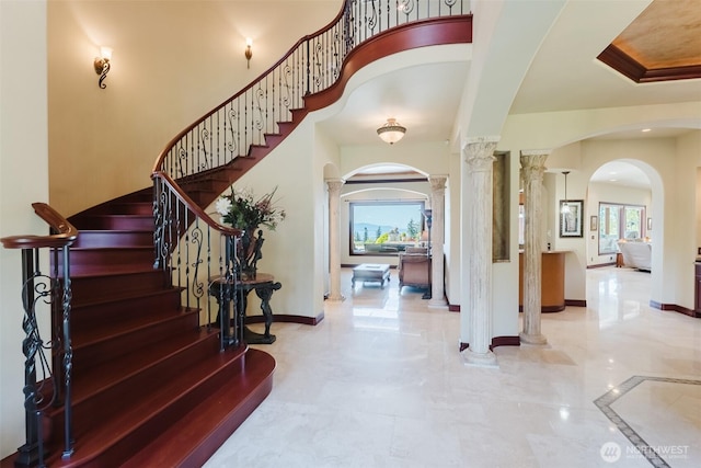 1844 Vineyard Pl, Bellingham, WA 98226 - foyer with ornate columns, arched walkways, plenty of natural light, and stairway