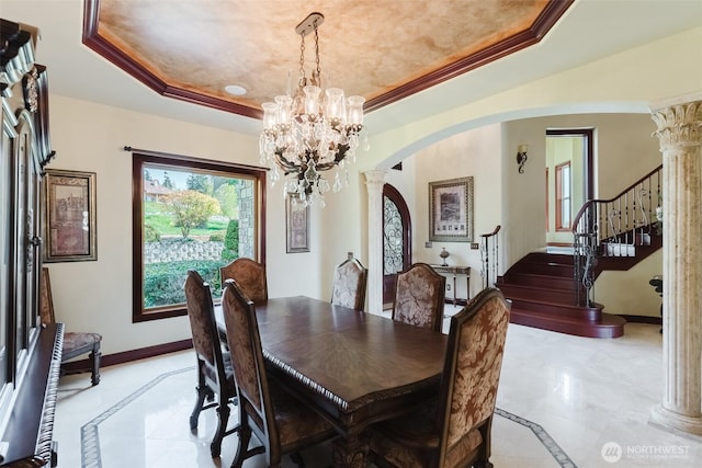 1844 Vineyard Pl, Bellingham, WA 98226 - dining space with inlaid floor details, a raised ceiling, arched walkways, and decorative columns