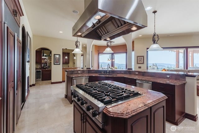 1844 Vineyard Pl, Bellingham, WA 98226 - kitchen with extractor fan, appliances with stainless steel finishes, arched walkways, beverage cooler, and a sink