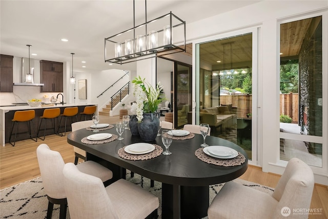 10207 NE 136th Pl, Lot, Kirkland, WA 98034 - dining area with light wood-style flooring, recessed lighting, a chandelier, and stairs
