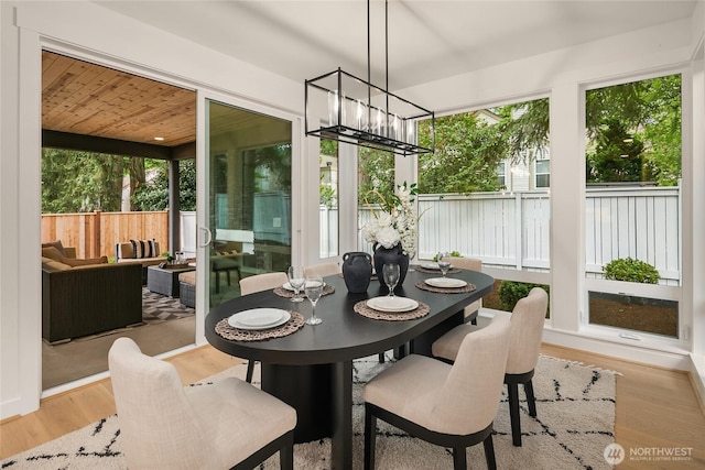 10207 NE 136th Pl, Lot, Kirkland, WA 98034 - sunroom with a chandelier, healthy amount of natural light, and wood finished floors