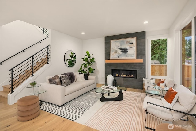 10207 NE 136th Pl, Lot, Kirkland, WA 98034 - living room with wood finished floors, a tiled fireplace, stairway, and recessed lighting