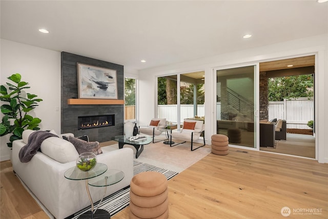 10207 NE 136th Pl, Lot, Kirkland, WA 98034 - living area featuring wood finished floors, a large fireplace, and recessed lighting