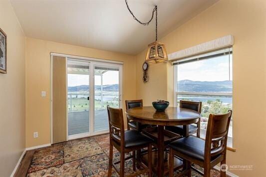 30350 Deer Meadows Rd E, Deer Meadows, WA 99122 - dining area featuring lofted ceiling and baseboards