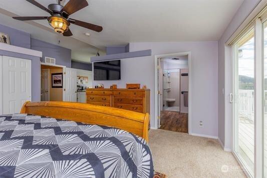 30350 Deer Meadows Rd E, Deer Meadows, WA 99122 - carpeted bedroom featuring baseboards, access to outside, ensuite bathroom, and ceiling fan