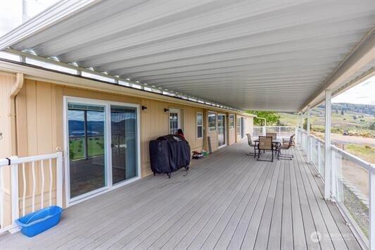 30350 Deer Meadows Rd E, Deer Meadows, WA 99122 - deck with outdoor dining space