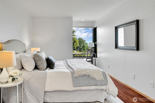 1605 5th Ave N Unit 402, Seattle, WA 98109 - bedroom featuring wood finished floors and baseboards