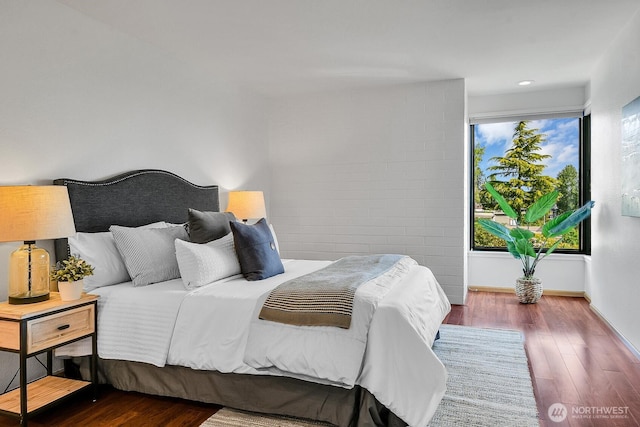1605 5th Ave N Unit 402, Seattle, WA 98109 - bedroom featuring wood finished floors and baseboards