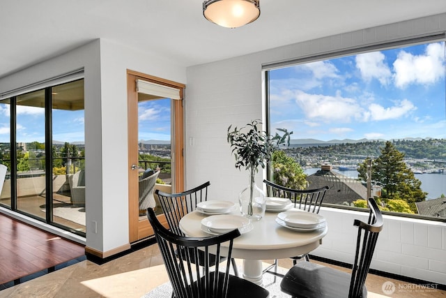 1605 5th Ave N Unit 402, Seattle, WA 98109 - dining room with plenty of natural light and a water and mountain view