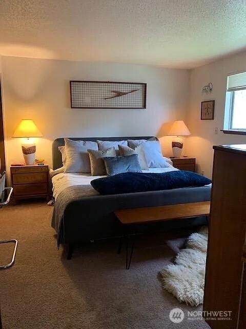 1417 N 7th St, Tacoma, WA 98403 - carpeted bedroom featuring a textured ceiling