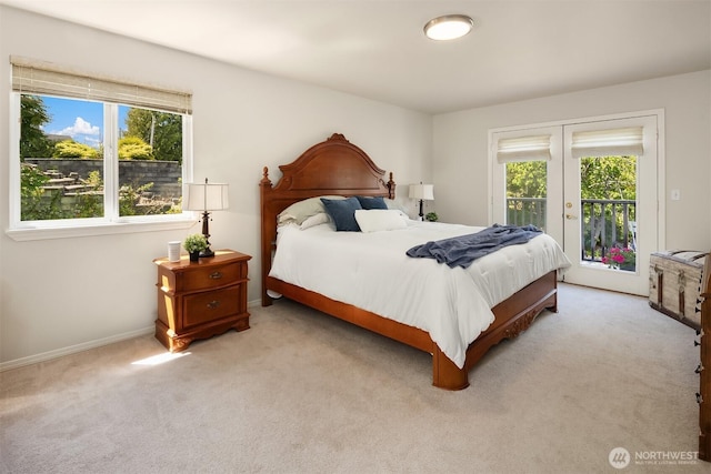 3120 Wave Dr, Everett, WA 98203 - bedroom featuring access to exterior, light colored carpet, french doors, and baseboards