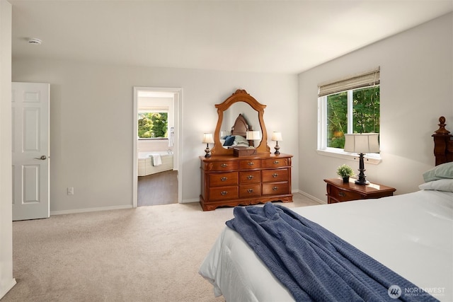 3120 Wave Dr, Everett, WA 98203 - bedroom with multiple windows, light colored carpet, and baseboards