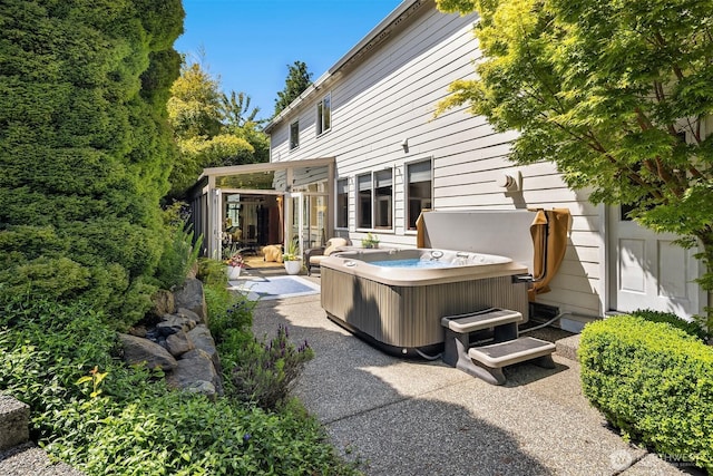 3120 Wave Dr, Everett, WA 98203 - rear view of house with a hot tub and a patio