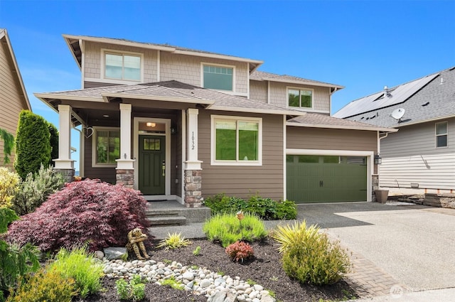 1032 76th Ave NE, Lake Stevens, WA 98258 - prairie-style home with driveway, a garage, stone siding, and roof with shingles