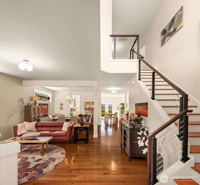1032 76th Ave NE, Lake Stevens, WA 98258 - living area featuring stairs, wood finished floors, and a chandelier