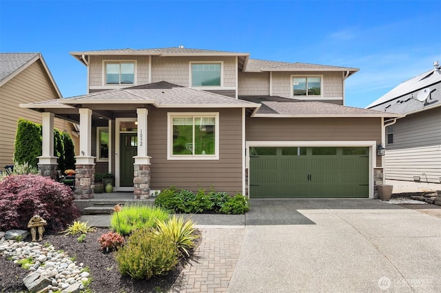 1032 76th Ave NE, Lake Stevens, WA 98258 - view of front of home featuring driveway, roof with shingles, and covered porch