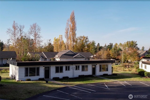 814 5th St Unit 8143, Steilacoom, WA 98388 - view of front of home with uncovered parking and a front yard