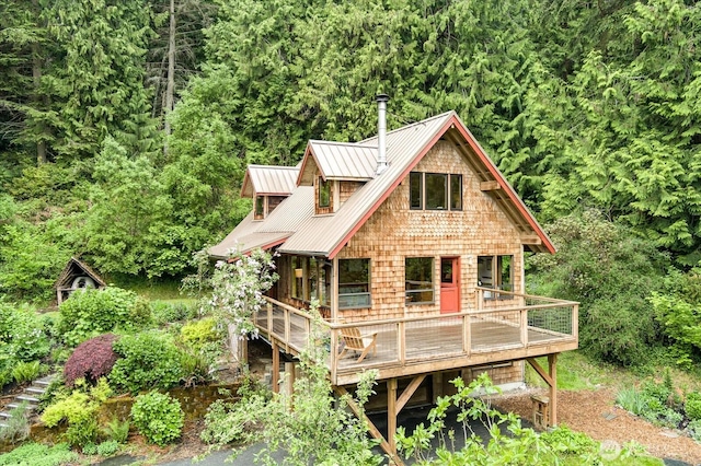 5092 Ribbit Rd, Langley, WA 98260 - view of front of house with metal roof and a forest view