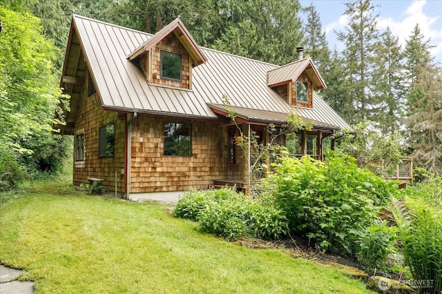 5092 Ribbit Rd, Langley, WA 98260 - view of front of property featuring a standing seam roof, a front yard, and metal roof