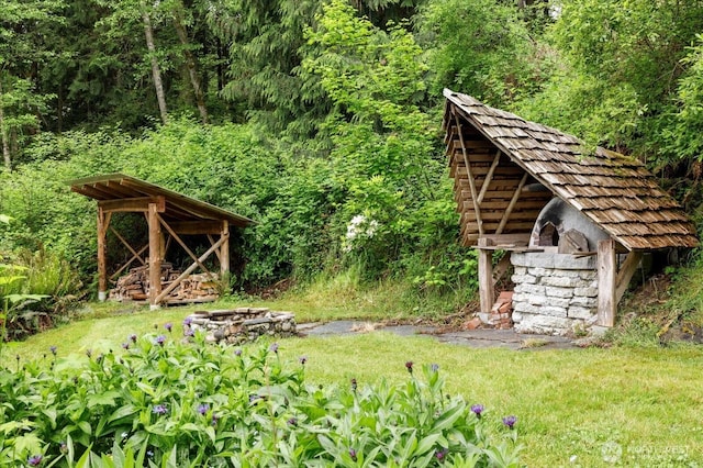 5092 Ribbit Rd, Langley, WA 98260 - view of yard featuring a fire pit and a wooded view