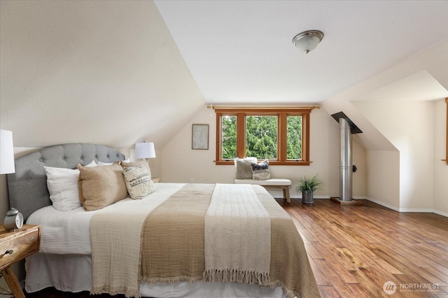 5092 Ribbit Rd, Langley, WA 98260 - bedroom with wood finished floors, vaulted ceiling, and baseboards