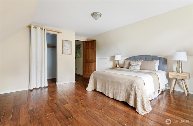 5092 Ribbit Rd, Langley, WA 98260 - bedroom featuring wood finished floors, a closet, and vaulted ceiling