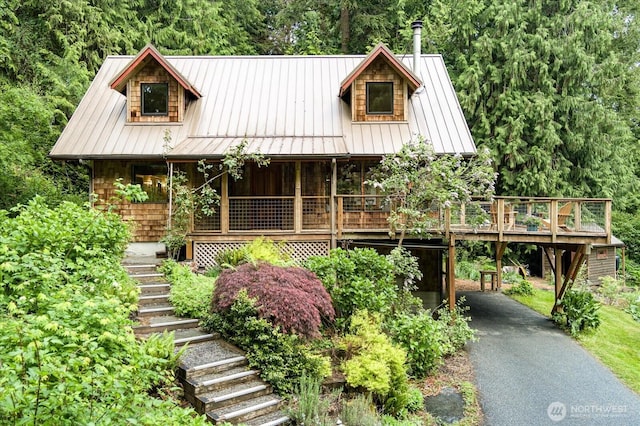 5092 Ribbit Rd, Langley, WA 98260 - view of front of house featuring stairway, a porch, asphalt driveway, metal roof, and a standing seam roof