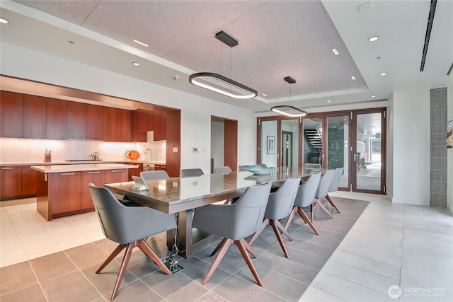 10700 NE 4th St Unit 1006, Bellevue, WA 98004 - dining area with a raised ceiling, light tile patterned floors, recessed lighting, and french doors