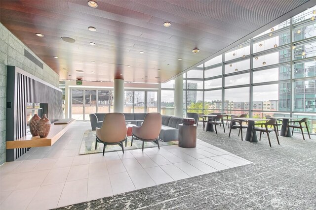 10700 NE 4th St Unit 1006, Bellevue, WA 98004 - lobby featuring floor to ceiling windows, recessed lighting, a city view, and a high ceiling
