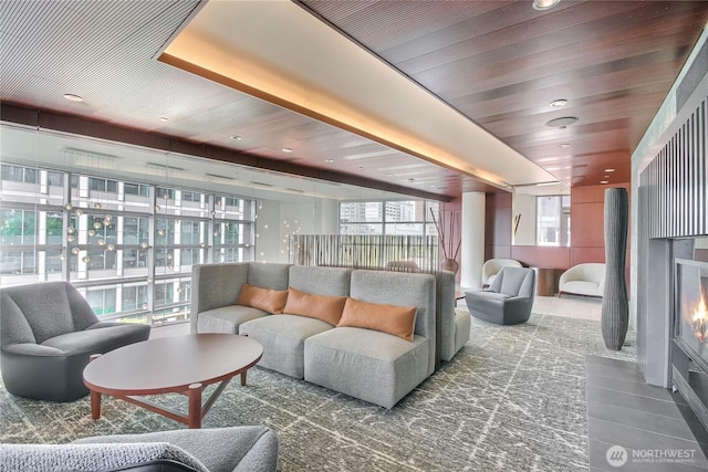 10700 NE 4th St Unit 1006, Bellevue, WA 98004 - tiled living room with healthy amount of natural light, a fireplace with flush hearth, and recessed lighting