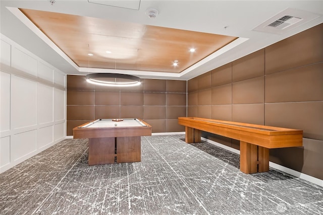 10700 NE 4th St Unit 1006, Bellevue, WA 98004 - recreation room with a tray ceiling, a decorative wall, and billiards