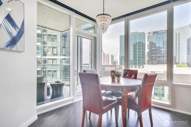 10700 NE 4th St Unit 1006, Bellevue, WA 98004 - dining area with plenty of natural light, a chandelier, a view of city, and dark wood-style flooring