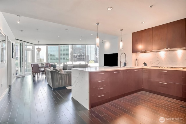 10700 NE 4th St Unit 1006, Bellevue, WA 98004 - kitchen with a sink, open floor plan, plenty of natural light, a peninsula, and recessed lighting