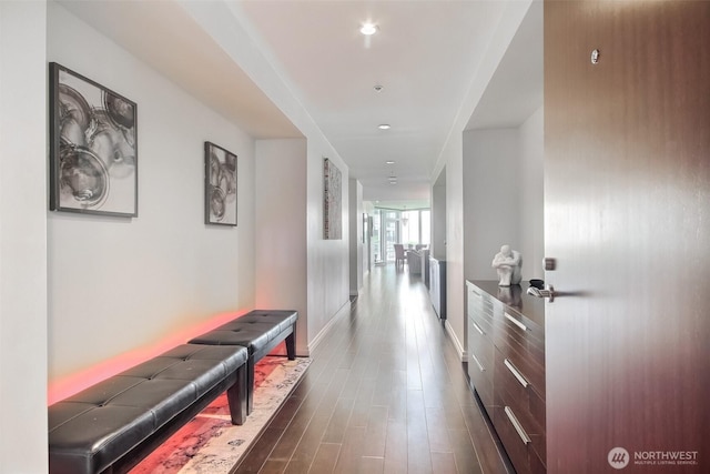 10700 NE 4th St Unit 1006, Bellevue, WA 98004 - corridor featuring baseboards and dark wood finished floors