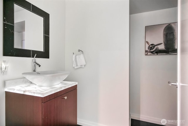10700 NE 4th St Unit 1006, Bellevue, WA 98004 - bathroom with vanity and baseboards