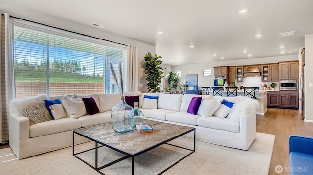 17916 139th Pl E, Puyallup, WA 98374 - living room featuring light wood-style flooring and recessed lighting