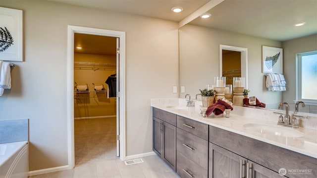 17916 139th Pl E, Puyallup, WA 98374 - bathroom featuring double vanity, recessed lighting, a garden tub, a spacious closet, and tile patterned floors