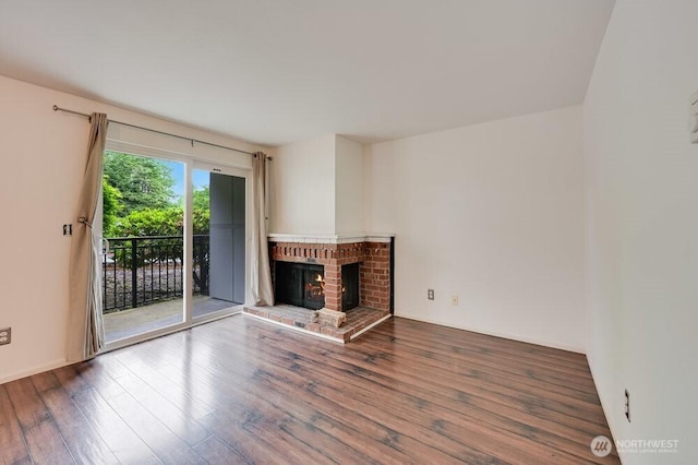 220 SW Clark St Unit B101, Issaquah, WA 98027 - unfurnished living room with wood finished floors and a fireplace