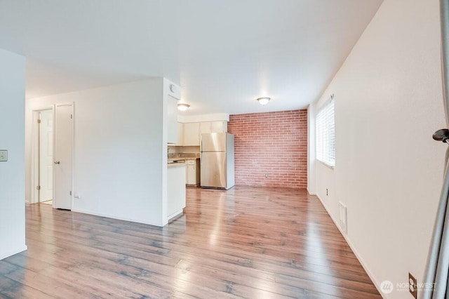 220 SW Clark St Unit B101, Issaquah, WA 98027 - unfurnished living room with light wood-style floors