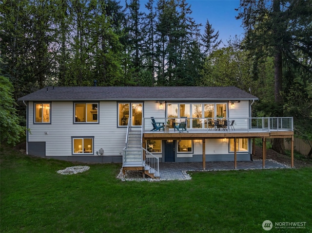 7429 NE 129th St, Kirkland, WA 98034 - rear view of property featuring stairway, a wooden deck, a patio, and a lawn