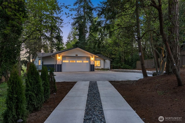 7429 NE 129th St, Kirkland, WA 98034 - view of front facade with driveway and a garage