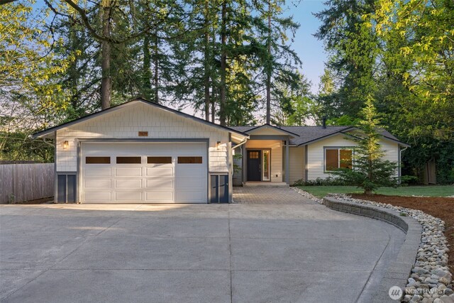 7429 NE 129th St, Kirkland, WA 98034 - ranch-style house with concrete driveway and a garage
