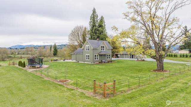 2217 200th St NE, Arlington, WA 98223 - back of house with a trampoline and a chimney