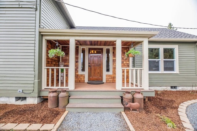 2217 200th St NE, Arlington, WA 98223 - entrance to property featuring a shingled roof, crawl space, and a porch