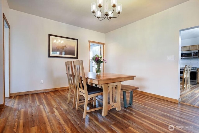 2217 200th St NE, Arlington, WA 98223 - dining room with a chandelier, wood finished floors, and baseboards