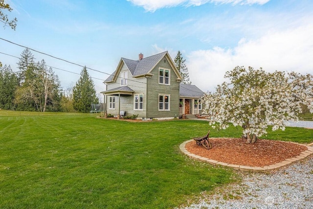 2217 200th St NE, Arlington, WA 98223 - view of front of home featuring a front yard and a chimney