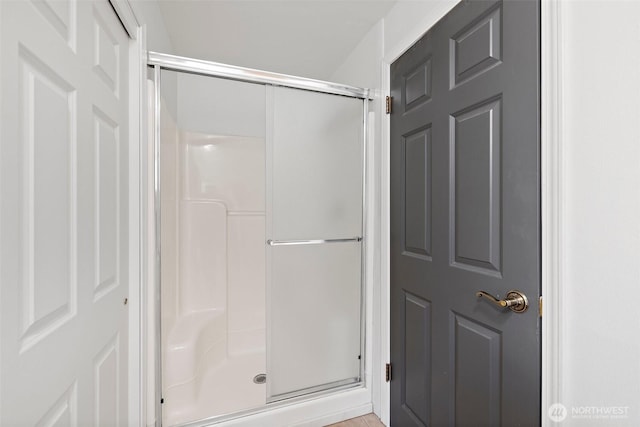 full bathroom featuring a shower stall