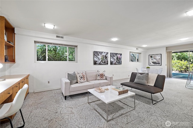 living room featuring baseboards