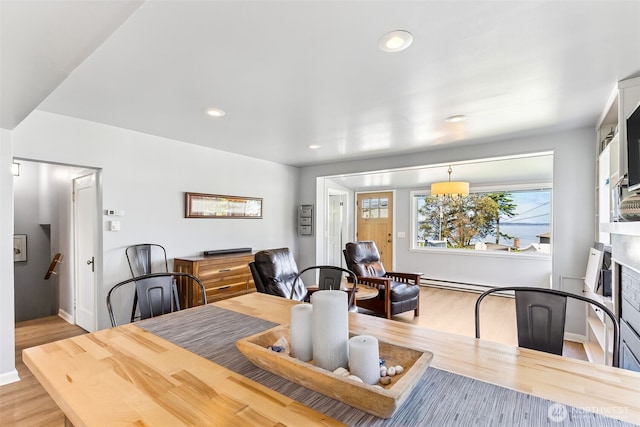232 N Sunset Dr, Camano Island, WA 98282 - dining area featuring light wood finished floors, baseboard heating, recessed lighting, and baseboards